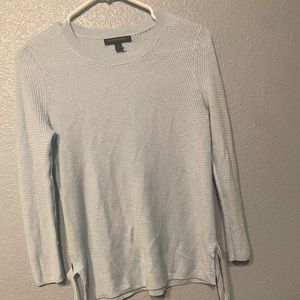 Baby blue sweatshirt with adjustable ties on the side
